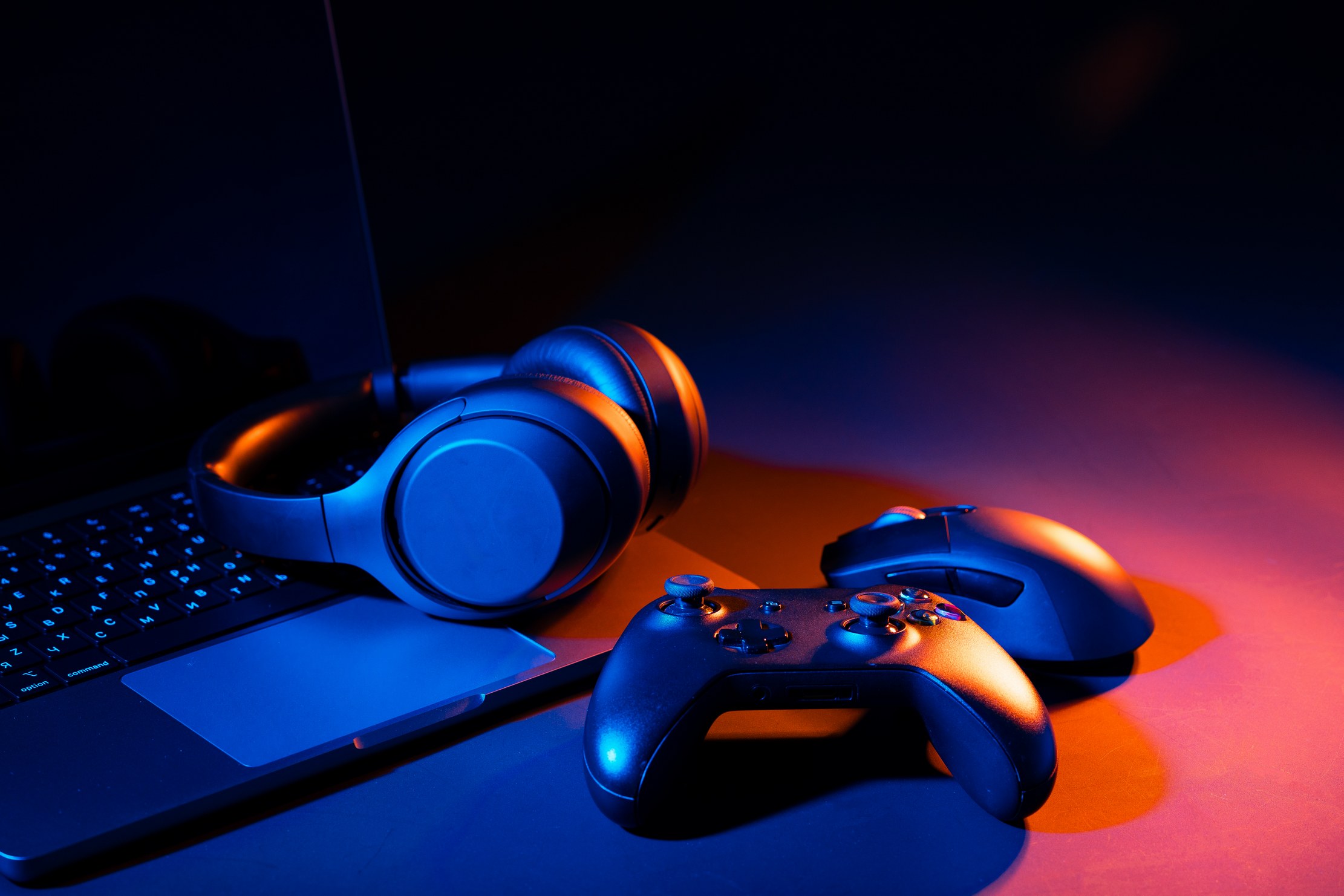 Keyboard, mouse, and controller on a game development workstation